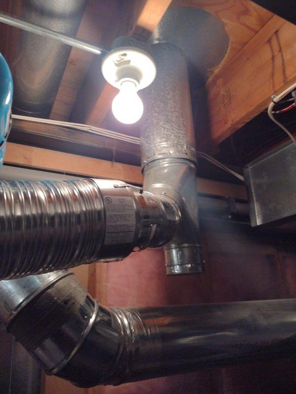 Completed installation of a 50-gallon residential tanked water heater in basement utility area. Properly configured all supply and discharge plumbing connections with black piping, installed pressure relief valve, and integrated blue pressure expansion tank with appropriate flexible connections. All work performed to code specifications with system tested and verified operational upon completion.