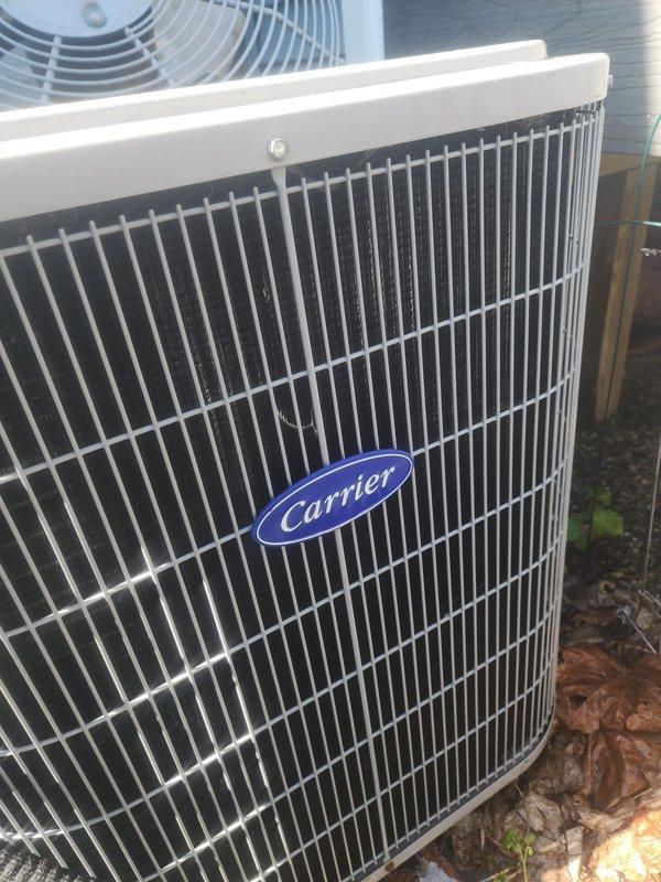 Completed scheduled preventive maintenance on Carrier air conditioning system. Performed comprehensive inspection of outdoor condenser unit, verified proper operation of all components, and documented equipment condition with photographs. Unit found in good working order with condenser coils intact and all refrigerant lines properly secured.