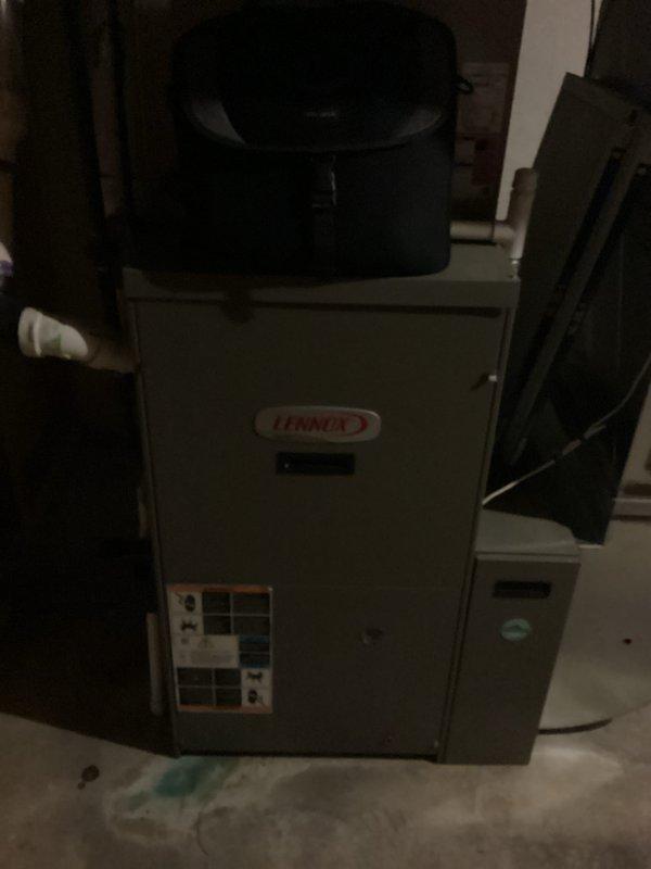 Conducted on-site assessment of existing Lennox furnace system located in basement utility area for complete HVAC replacement estimate. Documented current equipment condition, specifications, and installation configuration including connected copper refrigerant lines and plumbing connections. Photographed unit identification plates and surrounding mechanical room layout to provide accurate equipment sizing and replacement system recommendations.