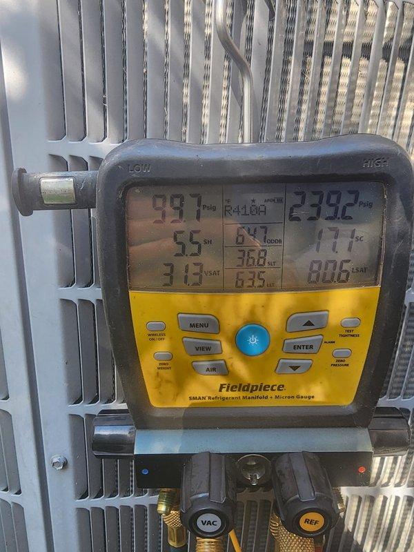 Completed preventative maintenance on outdoor air conditioning condenser unit. Performed system diagnostics using digital manifold gauges, recording refrigerant pressures at 99.7 psig low side and 239.2 psig high side with 5.5°F superheat. Inspected condenser coil fins, which were found to be clean and in good condition with proper airflow. Verified unit operation and all measured parameters within normal operating range for cooling season performance.