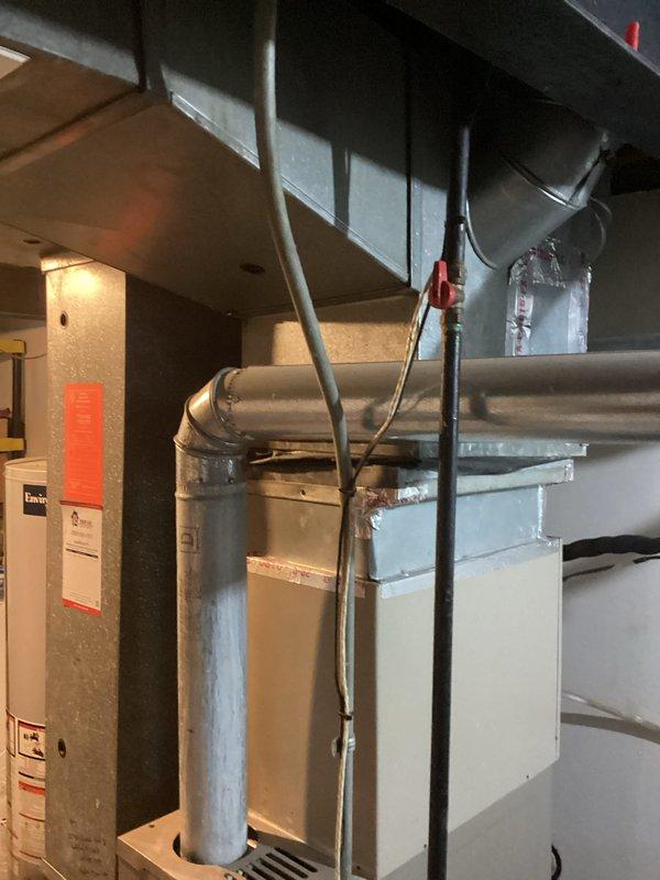 Conducted comprehensive on-site assessment of existing residential HVAC system in basement mechanical room to provide replacement estimate. Evaluated current furnace/air handler configuration, ductwork layout including horizontal trunk lines and branch connections, and overall system accessibility for equipment changeout. Documented existing equipment specifications, duct connections, clearances, and spatial constraints through photographic survey to determine optimal replacement equipment sizing and installation requirements.
