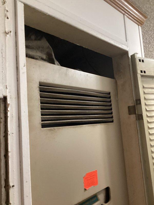 Conducted comprehensive site evaluation for complete air conditioning system replacement. Assessed existing Garrison brand outdoor condenser unit with diamond-pattern grille and indoor air handler equipment installed in interior closet space. Documented current equipment conditions, measurements, and installation requirements. Provided detailed replacement estimate for new HVAC system including removal of existing components and installation specifications for updated equipment.