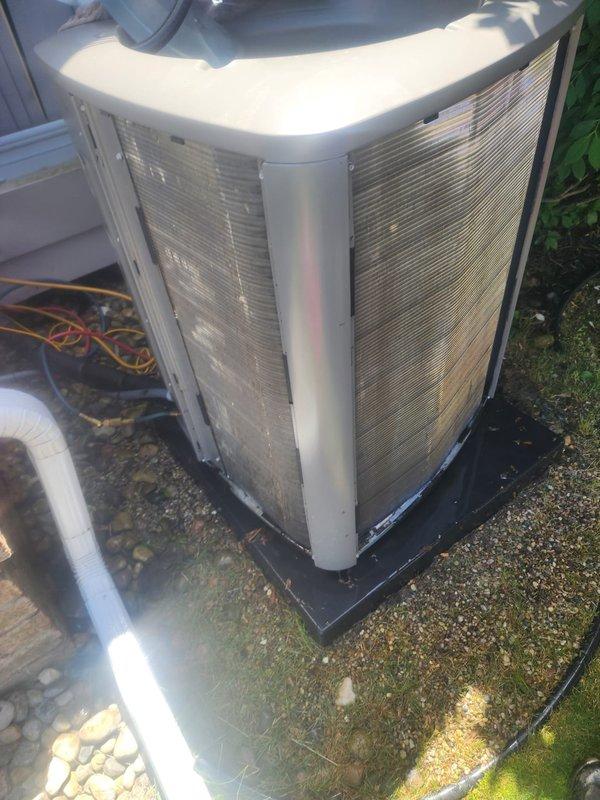 Responded to no cooling call and performed system inspection. Found outdoor condenser unit with heavily soiled coil fins and restricted airflow due to accumulated dirt and debris. Documented existing conditions of both outdoor condensing unit and indoor air handler components, including compressor, refrigerant lines, evaporator coil, and electrical connections. Coordinated service visit timing to accommodate occupant schedule with responsible adult present on site.