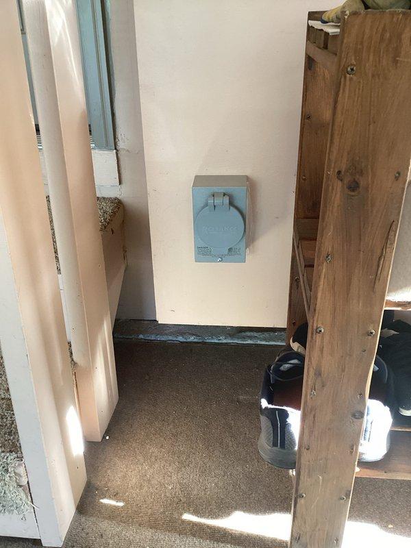 Installed mechanical interlock system and 30-amp power inlet on residential electrical panel to enable safe generator connection during power outages. Installation completed on exterior wall with proper weatherproof enclosure and verified all safety mechanisms functioning correctly.