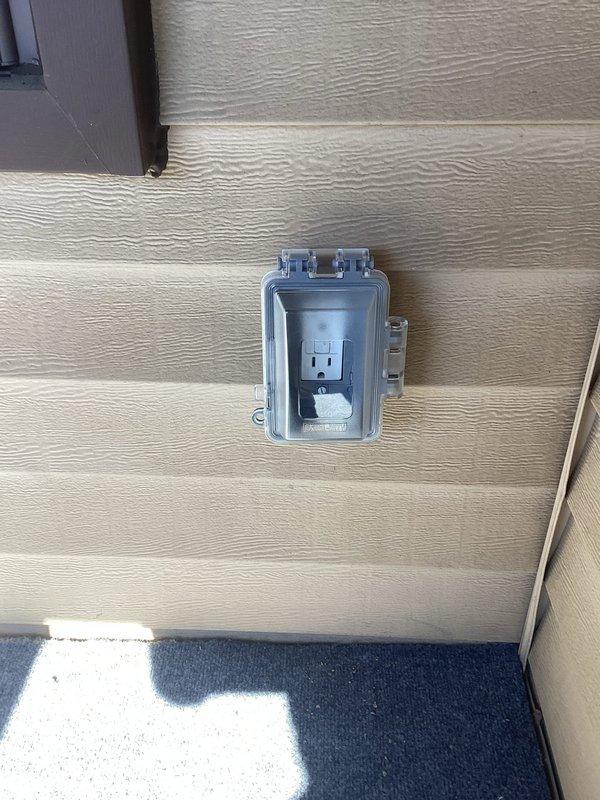 Responded to service call following home inspection findings. Corrected open neutral condition on bedroom outlet by identifying and properly securing loose neutral wire connection. Installed GFCI receptacles in three required locations: kitchen countertop area, exterior back patio weatherproof enclosure, and bathroom. All GFCI devices tested and verified proper operation of ground fault protection. Confirmed all outlets properly grounded and meeting current electrical code requirements.