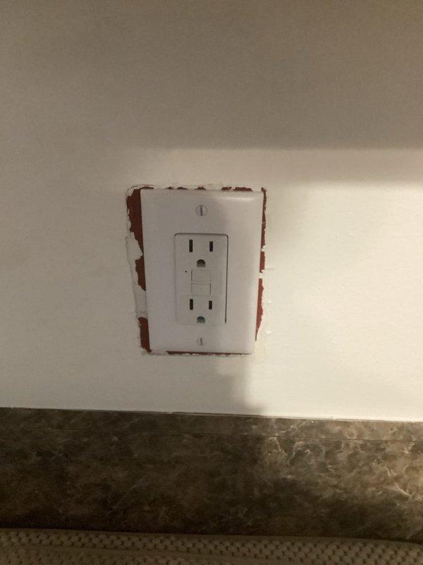 Responded to service call following home inspection findings. Corrected open neutral condition on bedroom outlet by identifying and properly securing loose neutral wire connection. Installed GFCI receptacles in three required locations: kitchen countertop area, exterior back patio weatherproof enclosure, and bathroom. All GFCI devices tested and verified proper operation of ground fault protection. Confirmed all outlets properly grounded and meeting current electrical code requirements.