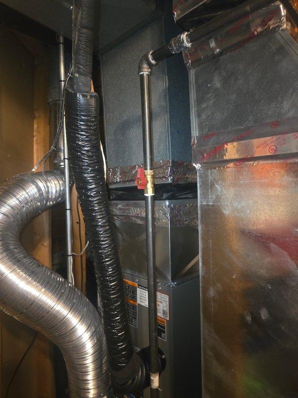 Completed warranty corrections on HVAC installation including proper alignment and leveling of supply-side ductwork at AC coil. Verified and corrected chimney system installation for furnace and water heater, ensuring proper 1/4" per foot upward pitch from water heater diverter to chimney connection. Inspected 4" elbow on water heater diverter to confirm minimum 26-gauge specification compliance. Corrected electrical issue by replacing oversized 25-amp fuses with proper 20-amp fuses per compressor nameplate specifications. Documented all corrections with photos and completed required follow-up documentation.