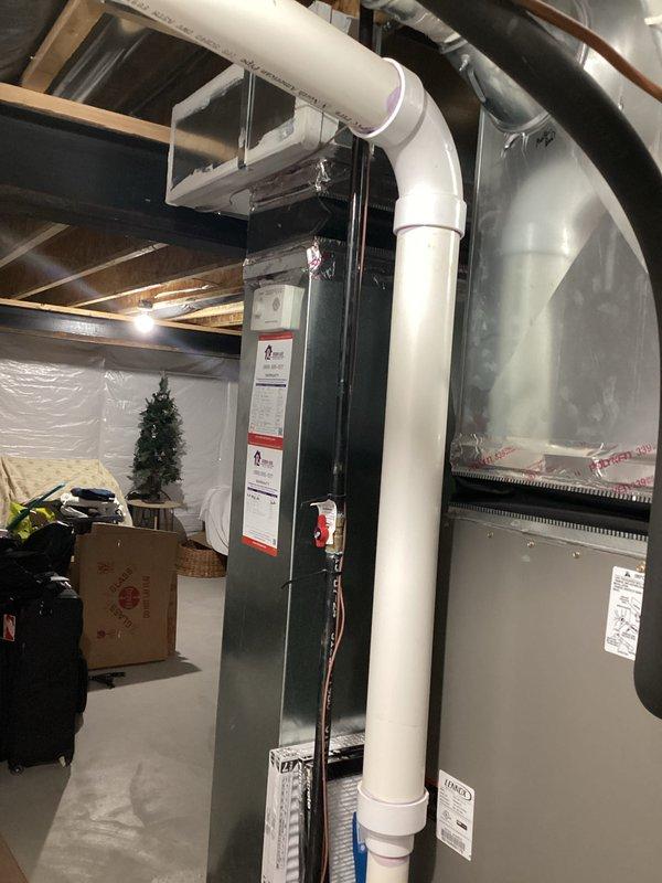 Completed estimate for replacement of 10-year-old air conditioning system that was found to be low on refrigerant. Assessed existing Lennox furnace and air handler installation in basement mechanical room, documented current system configuration including ductwork, PVC venting, and copper refrigerant lines. Provided homeowner with replacement options and recommendations based on age of equipment and refrigerant loss issue.