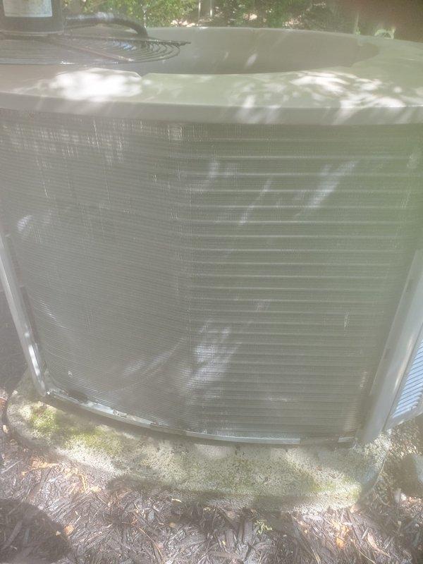 Completed comprehensive cooling system maintenance and tune-up on outdoor air conditioning condenser unit. Performed full system inspection, cleaned condenser coils and louvers, checked refrigerant levels and pressures, tested electrical connections and capacitors, verified proper airflow through intake grilles, and confirmed optimal system operation. Unit is functioning properly with no issues identified.