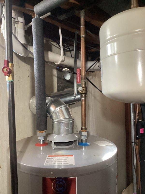 Conducted on-site assessment and provided estimate for water heater replacement in residential mechanical room. Evaluated existing State Select water heater installation, including all plumbing connections, copper supply lines, PVC venting system, expansion tank mounting, and safety components. Documented current equipment configuration with pressure relief valve, shut-off valves, and flue pipe assembly to prepare comprehensive replacement quote.