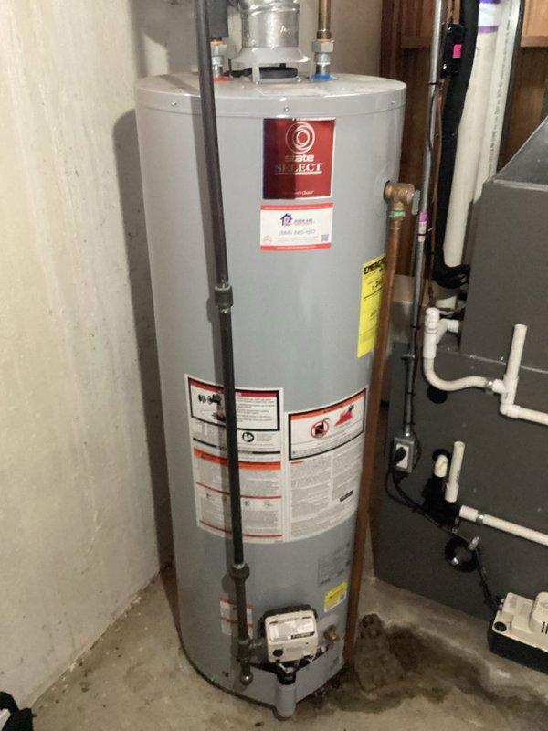 Conducted on-site assessment and provided estimate for water heater replacement in residential mechanical room. Evaluated existing State Select water heater installation, including all plumbing connections, copper supply lines, PVC venting system, expansion tank mounting, and safety components. Documented current equipment configuration with pressure relief valve, shut-off valves, and flue pipe assembly to prepare comprehensive replacement quote.
