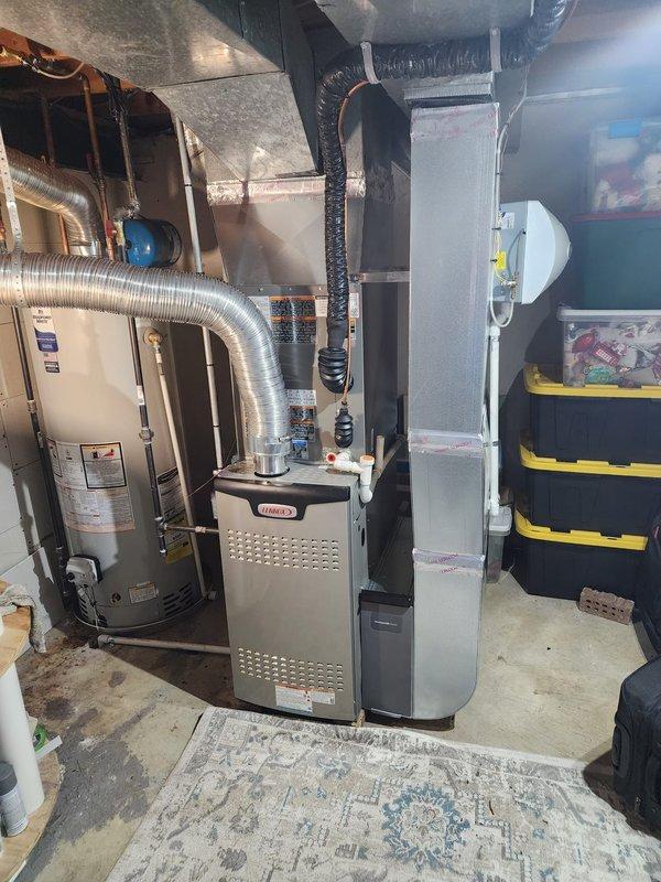 Completed full HVAC system installation including Lennox furnace, air conditioning unit, and water heater in basement utility space. All equipment installed to manufacturer specifications with proper venting, ductwork connections, and electrical hookups. System tested and operational, with financing documentation completed and identification verified on file.