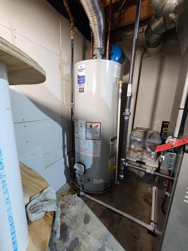 Completed full HVAC system installation including Lennox furnace, air conditioning unit, and water heater in basement utility space. All equipment installed to manufacturer specifications with proper venting, ductwork connections, and electrical hookups. System tested and operational, with financing documentation completed and identification verified on file.