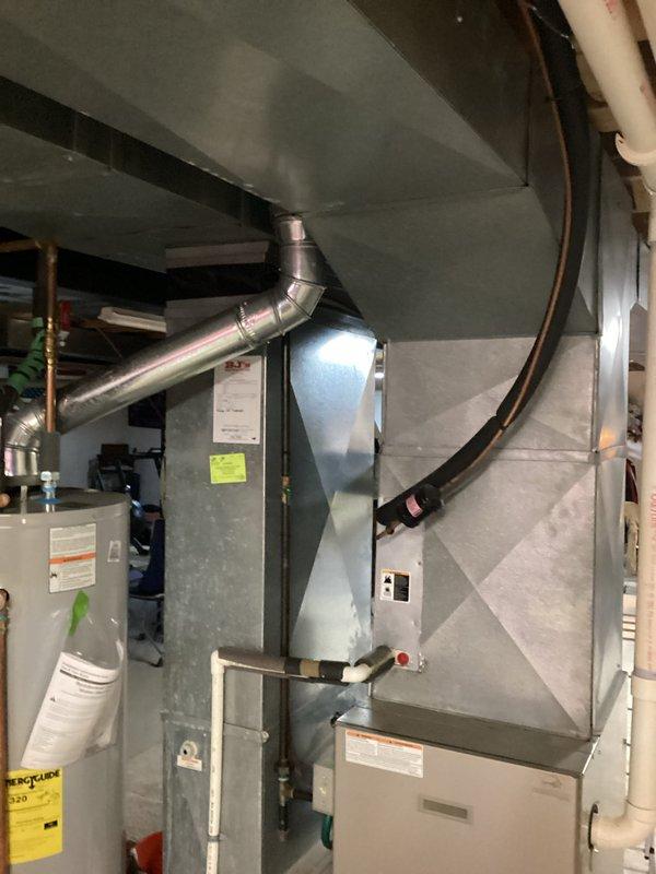 Conducted comprehensive HVAC replacement estimate for dual-system residential installation, evaluating two 20-year-old units including Bryant Plus 90i furnace and associated air handler equipment located in basement mechanical room. Documented existing equipment configuration, ductwork connections, venting systems, and utility connections through detailed photographic assessment to provide accurate replacement specifications for complete system upgrade.
