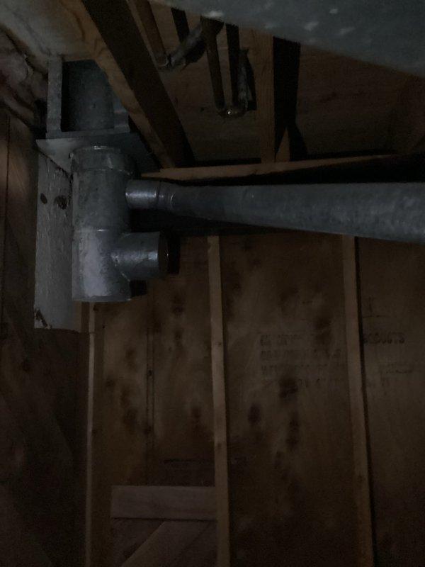 Conducted on-site assessment for hot water tank replacement in residential utility room. Documented existing gas-fired water heater installation with copper supply lines, pressure relief valve, and PVC venting connections, along with adjacent furnace system. Photographed equipment specifications, plumbing connections, and surrounding mechanical room conditions to prepare comprehensive replacement estimate for property owner's review via email.