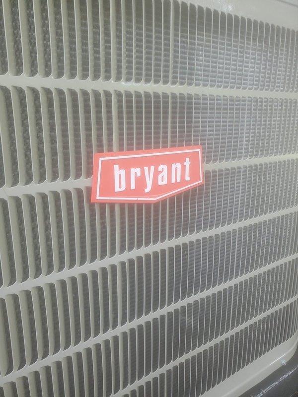 Completed scheduled preventive maintenance on Bryant residential air conditioning system. Inspected exterior unit including condenser coil and ventilation panels, verified proper airflow through grille assembly, and checked condensate drain system with trap and drain line for proper operation. All components found in satisfactory working condition with no immediate service needs identified.