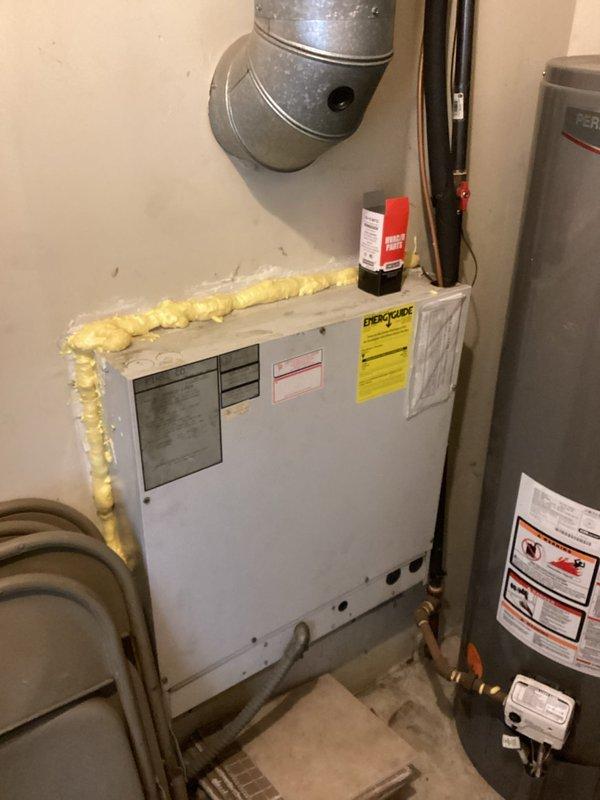 Assessed a non-operational AC wall unit located in a fourth-floor furnace room of a condominium building. The existing system is over 20 years old and has reached the end of its serviceable life. Documented the current HVAC equipment configuration, including the furnace unit, associated ductwork, copper refrigerant lines, and condensate drainage system. Observed aging infrastructure with visible corrosion on metal piping components. Provided a comprehensive replacement estimate for a new AC unit suitable for the existing installation space and mechanical room layout.