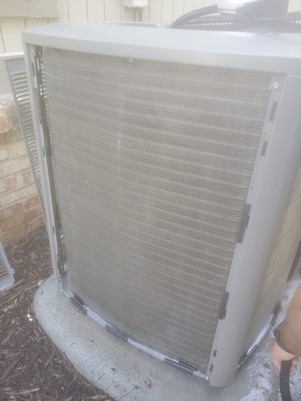 # HVAC Cooling System Maintenance and Tune-Up

Performed comprehensive preventive maintenance tune-up on residential split-system air conditioning unit. Upon arrival, system was operational but indoor evaporator coil exhibited significant frost and ice accumulation on compressor components and condensate pan, indicating potential airflow restriction or refrigerant charge concerns.

Conducted thorough inspection of outdoor condensing unit, noting debris accumulation around base and exterior cabinet. Cleaned condenser coil fins to restore proper airflow and heat exchange efficiency. Verified proper unit levelness on concrete pad and cleared surrounding area of leaves and organic debris.

Addressed indoor evaporator coil icing issue by checking system airflow, filter condition, and refrigerant pressures. Monitored system operation to ensure proper defrost cycle and adequate air circulation across coil surfaces. Inspected refrigerant lines for proper insulation and secure connections at bo