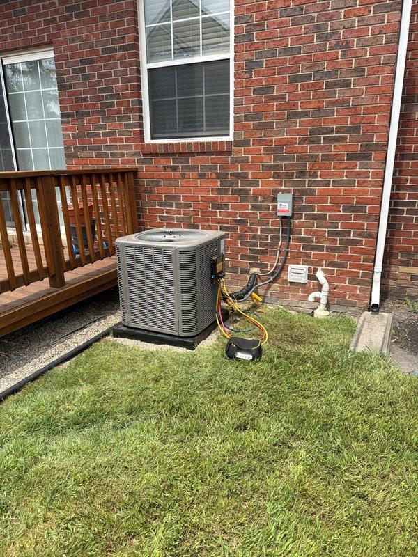 Completed installation of new Lennox air conditioning system at residential property. Installed outdoor condenser unit on gravel pad with proper refrigerant line routing and electrical connections to existing indoor air handler, ensuring all components were properly connected, tested, and operational per manufacturer specifications.