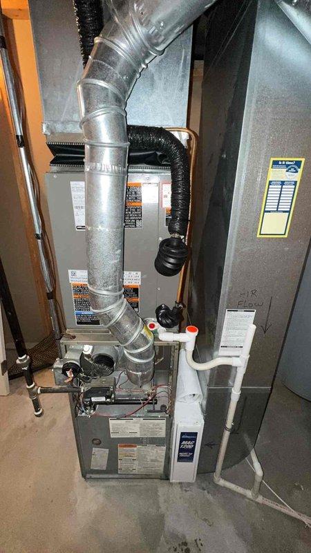 Completed installation of new Lennox air conditioning system at residential property. Installed outdoor condenser unit on gravel pad with proper refrigerant line routing and electrical connections to existing indoor air handler, ensuring all components were properly connected, tested, and operational per manufacturer specifications.
