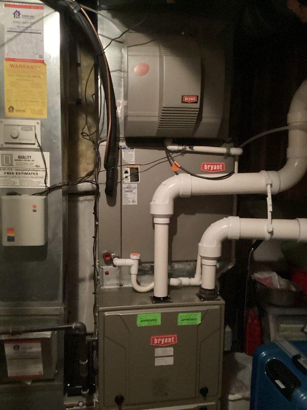 Completed air conditioning replacement estimate for residential HVAC system. Customer declined maintenance service and requested full system replacement quote instead. Evaluated existing Bryant furnace, humidifier, and associated ductwork configuration in basement mechanical room, documenting current installation including PVC condensate drainage lines, electrical connections, and ventilation components to provide accurate replacement specifications.