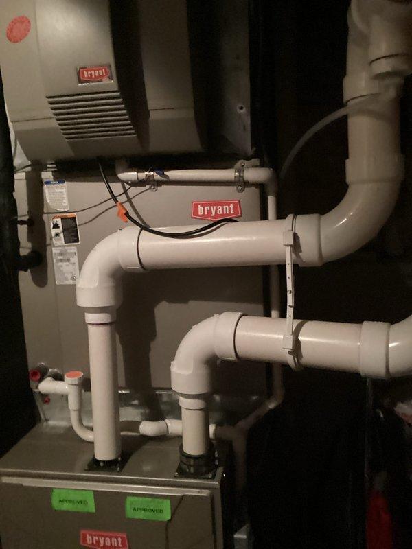 Completed air conditioning replacement estimate for residential HVAC system. Customer declined maintenance service and requested full system replacement quote instead. Evaluated existing Bryant furnace, humidifier, and associated ductwork configuration in basement mechanical room, documenting current installation including PVC condensate drainage lines, electrical connections, and ventilation components to provide accurate replacement specifications.