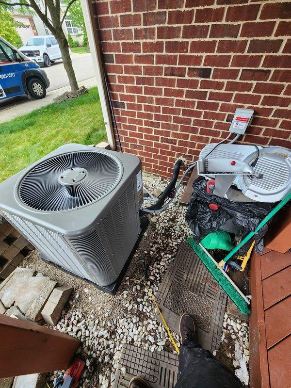 Completed installation of new Lennox air conditioning system including outdoor condenser unit positioned on gravel pad adjacent to existing Bryant furnace in basement mechanical room. Installed refrigerant lines, condensate drainage piping, electrical connections, and integrated new A/C coil with existing furnace system. All equipment tested and operational, with proper airflow verified and system commissioned per manufacturer specifications.