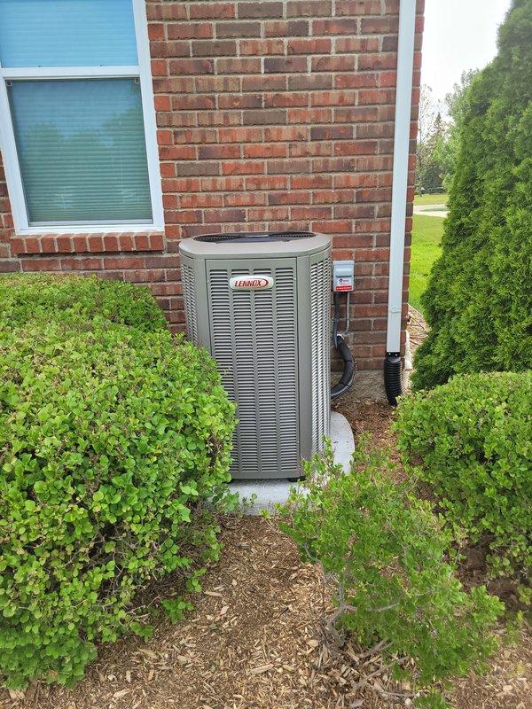 Completed full HVAC system installation including Lennox furnace, Lennox air conditioning condenser unit, and S40 smart thermostat. The outdoor condenser was positioned on a concrete pad against the exterior brick wall with proper clearances maintained for airflow and serviceability. All equipment was installed to manufacturer specifications, electrical connections were completed and verified, refrigerant lines were properly charged, and the thermostat was programmed and tested for proper system operation.