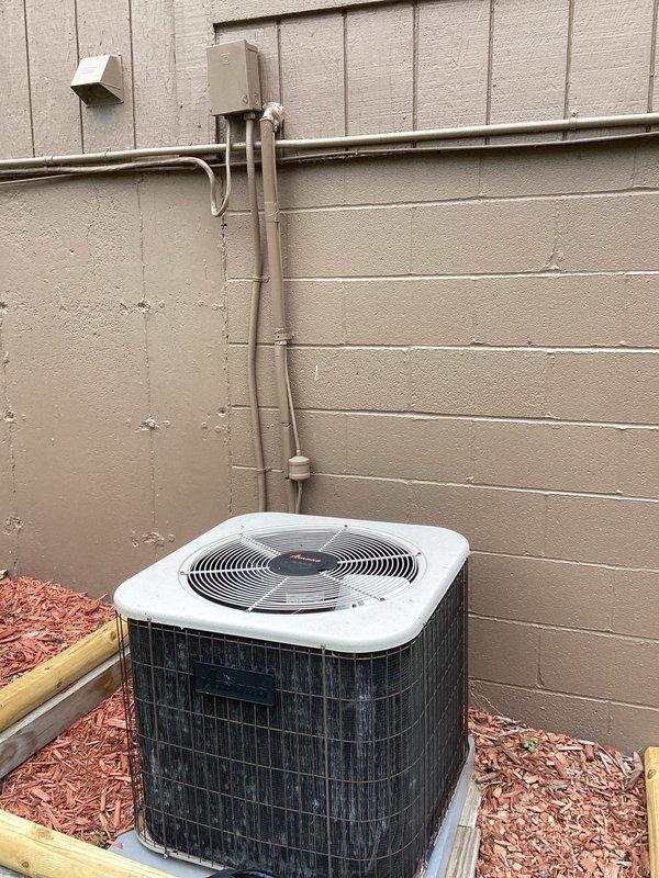 Provided comprehensive replacement estimate for 1995 residential air conditioning system experiencing refrigerant leak. Evaluated existing outdoor condenser unit, electrical disconnect, and associated electrical panel to determine complete system replacement requirements and ensure proper capacity sizing for customer's cooling needs.