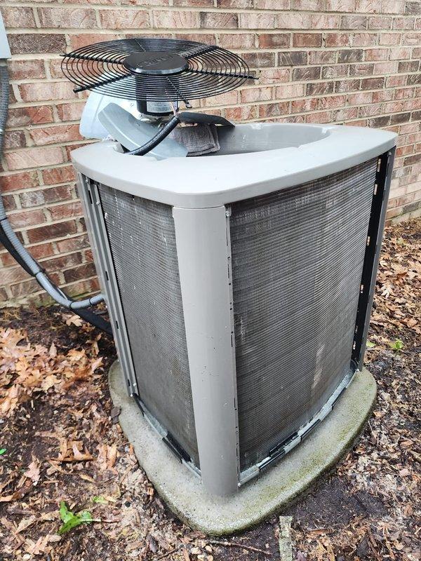 Completed routine cooling season maintenance on residential air conditioning system. Performed comprehensive inspection of outdoor condensing unit, including visual assessment of cabinet condition, airflow components, and refrigerant line connections. Observed normal weathering consistent with outdoor installation, with unit operational and all major components functioning within acceptable parameters. Documented existing surface rust on compressor mounting platform and minor debris accumulation around unit perimeter for future monitoring.