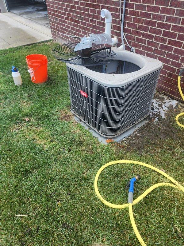 Responded to no cooling call on 11-year-old residential air conditioning system. Upon arrival, confirmed 24 VAC fuse open error code and complete loss of cooling throughout home. Inspected outdoor condenser unit and removed top panel to access internal components. Diagnosed blown low-voltage fuse caused by short circuit in control board wiring. Replaced defective 3-amp fuse and repaired damaged wire connections at transformer. Tested system operation and verified proper 24-volt control circuit function. Confirmed compressor and condenser fan motor startup, checked refrigerant pressures within normal range, and restored full cooling capacity to residence.