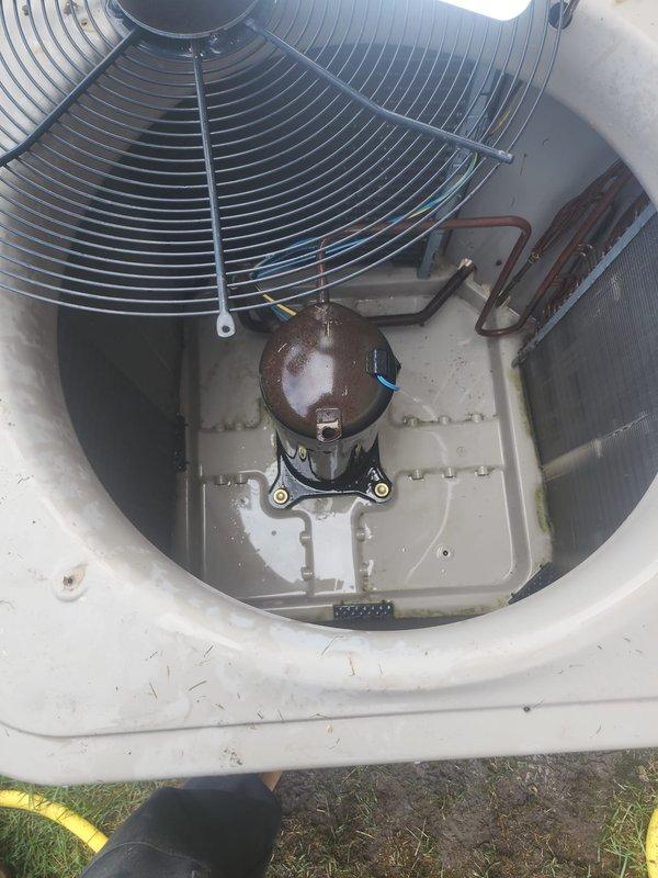 Responded to no cooling call on 11-year-old residential air conditioning system. Upon arrival, confirmed 24 VAC fuse open error code and complete loss of cooling throughout home. Inspected outdoor condenser unit and removed top panel to access internal components. Diagnosed blown low-voltage fuse caused by short circuit in control board wiring. Replaced defective 3-amp fuse and repaired damaged wire connections at transformer. Tested system operation and verified proper 24-volt control circuit function. Confirmed compressor and condenser fan motor startup, checked refrigerant pressures within normal range, and restored full cooling capacity to residence.