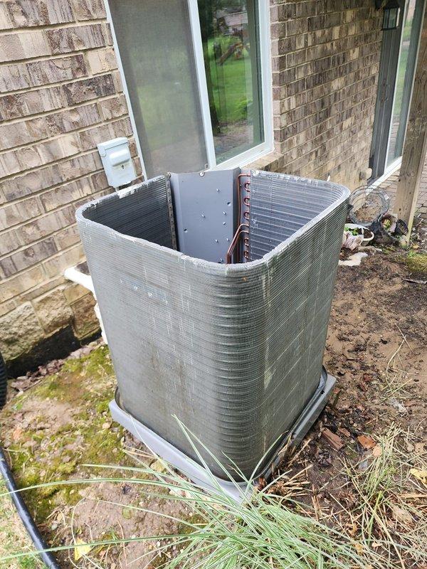 Completed preventive maintenance service on outdoor air conditioning condenser unit under Worry Free Service Agreement. Performed comprehensive system inspection including examination of compressor, refrigerant lines, electrical connections, and condensate drain pan. All copper refrigerant lines verified intact with proper insulation, compressor operating within normal parameters, and electrical connections secure with no signs of overheating or corrosion. Drain pan showing normal condensate staining consistent with regular operation. Unit exterior cleaned and top cover properly secured following inspection.