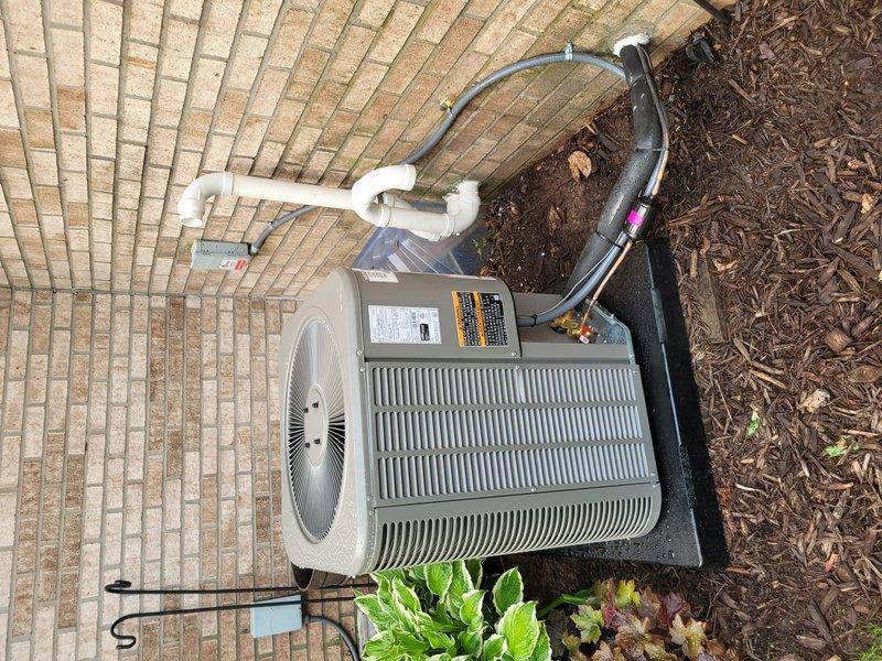 Completed full HVAC system installation including new Lennox furnace and air conditioner with outdoor condenser unit positioned on brick paver patio with proper pad placement. Installed refrigerant line set with insulation, PVC condensate drainage system with proper pitch and trap configuration, and electrical disconnect. All refrigerant lines properly secured and transitioned through building envelope using appropriate penetration methods. System tested for proper operation, airflow, and refrigerant charge levels meeting manufacturer specifications.