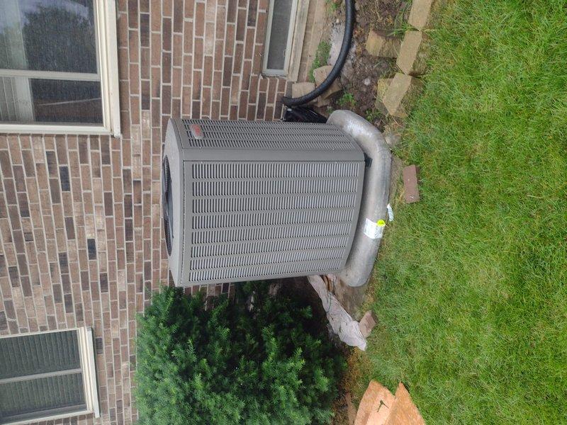 Completed full HVAC system installation including Lennox furnace, air conditioner, S40 smart thermostat, and whole-home humidifier. The new outdoor condensing unit was positioned on a concrete pad against the brick exterior with proper refrigerant line routing and insulation. All equipment was installed to manufacturer specifications, electrical connections verified, refrigerant lines properly charged, and system tested for optimal performance and efficiency.
