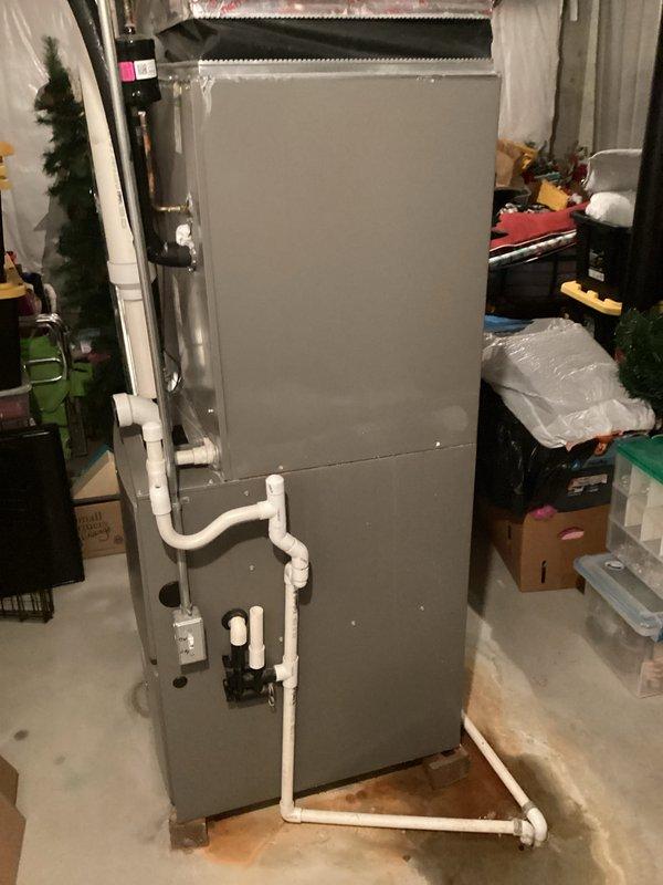 Conducted comprehensive HVAC system evaluation for equipment replacement estimate at residential property. Assessed existing air handler unit located in basement utility area, documenting current system configuration including metal ductwork connections, PVC condensate drain lines, and overall installation conditions. Provided detailed replacement quote as customer comparison-shopped multiple contractors for new system installation.
