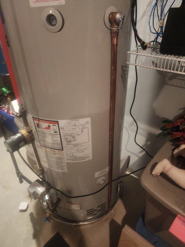 Corrected relief valve discharge piping on Bradford White water heater to comply with Section 28 of Michigan 2015 MRC requirements. Installed proper drainage system with appropriate PVC piping and fittings, documented installation with photographs per inspection protocol, and completed required follow-up documentation to satisfy warranty compliance without necessitating re-inspection.