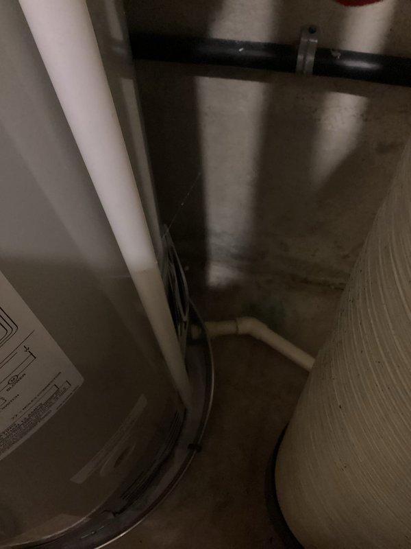 Completed warranty work involving drain pan discharge piping compliance by replacing non-compliant PVC materials with approved piping per MPC table 605.4 specifications. Installed 50-gallon electric water heater with electric anode rod and added ball valve for proper system control. All work documented with photographs and required warranty documentation completed per manufacturer specifications.
