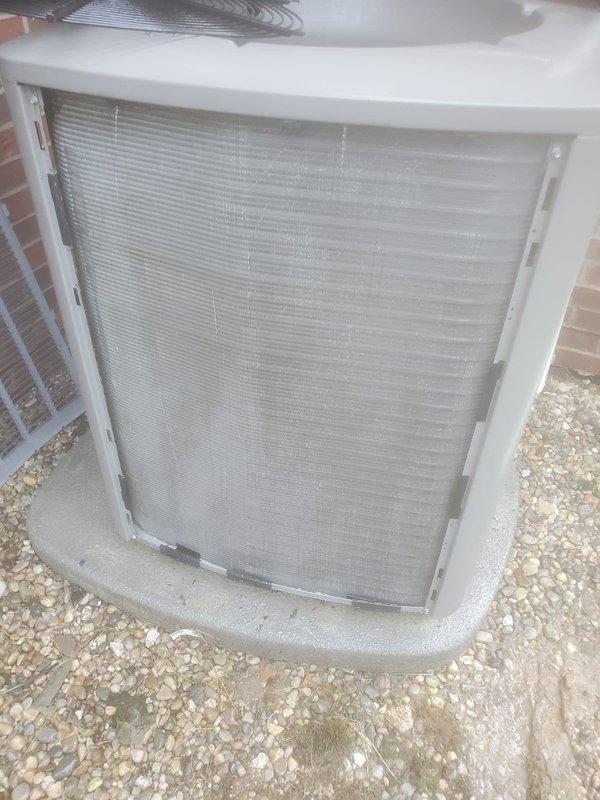 Completed routine AC maintenance on a split system cooling unit. Performed inspection of outdoor condenser unit including cleaning of filter screen panel which showed moderate dust and debris accumulation, examined refrigerant lines and electrical connections at indoor evaporator coil, and verified proper system operation with all components functioning within normal parameters.