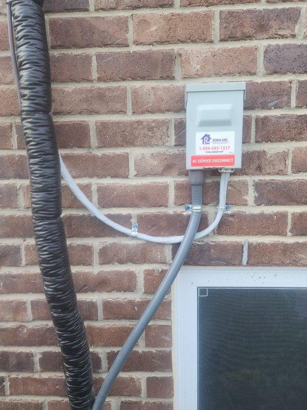 Completed full HVAC system installation including Lennox furnace, air conditioner, S40 thermostat, and humidifier. Installed outdoor condenser unit on concrete pad with proper electrical disconnect box mounted to exterior brick wall. Ran conduit and electrical connections from disconnect to unit per code requirements. Verified proper clearance for AC disconnect and all exterior components. Programmed and tested S40 thermostat to resolve reported programming concerns. Installed humidifier and integrated with new system. Removed old heating units from property as requested. Tested all equipment for proper operation including heating, cooling, and humidification functions. System running within manufacturer specifications. Documentation and photos completed for warranty follow-up.