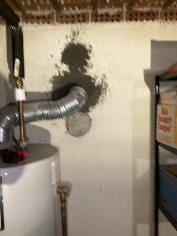 Completed full HVAC system replacement for a 38-year-old unit that had experienced multiple repair failures. Customer elected to replace the entire system rather than continue temporary repairs. Installation was scheduled with flexibility to accommodate customer availability, avoiding midday conflicts.

Inspection revealed aging equipment in basement utility area with deteriorated ductwork connections showing significant soot staining around penetration points. Existing flexible ductwork displayed signs of long-term wear and poor sealing at wall connections. System components included outdated equipment with compromised efficiency and reliability.

Removed and replaced complete HVAC system including air handler, condensing unit, and associated components. Addressed ductwork concerns at wall penetrations where previous staining indicated air leakage and potential combustion byproduct issues. Ensured proper sealing and connection of all new flexible ductwork to prevent future air quality