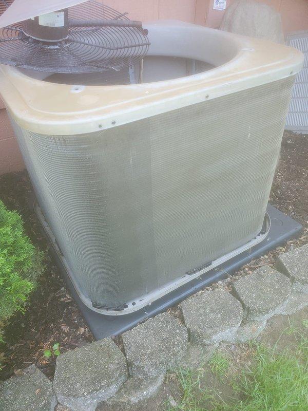 Completed DTE rebate maintenance inspection on residential air conditioning system. Outdoor condenser unit was photographed showing proper installation on composite pad with clear access for service. During inspection, discovered significant frost accumulation on indoor evaporator coil and blower assembly, indicating potential airflow restriction or refrigerant issue requiring further diagnosis. Documentation and photos processed for DTE rebate program submission.