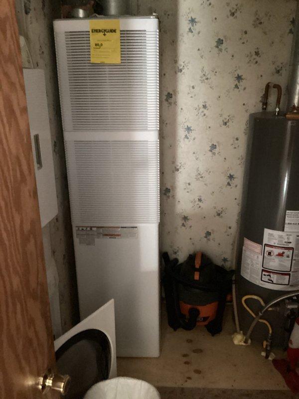 Completed estimate for full HVAC system replacement on residential property. Existing system is over 10 years old and non-operational. Evaluated Intertherm indoor air handler unit located in basement utility area and outdoor condenser unit on exterior concrete pad. Documented current equipment configuration, electrical service connections, and existing ductwork. Photographed both indoor and outdoor components to assess installation requirements and provide accurate replacement specifications. Homeowner is obtaining additional quotes before making final decision.