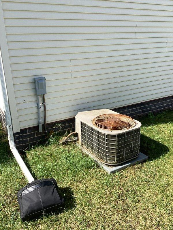 Completed estimate for full HVAC system replacement on residential property. Existing system is over 10 years old and non-operational. Evaluated Intertherm indoor air handler unit located in basement utility area and outdoor condenser unit on exterior concrete pad. Documented current equipment configuration, electrical service connections, and existing ductwork. Photographed both indoor and outdoor components to assess installation requirements and provide accurate replacement specifications. Homeowner is obtaining additional quotes before making final decision.