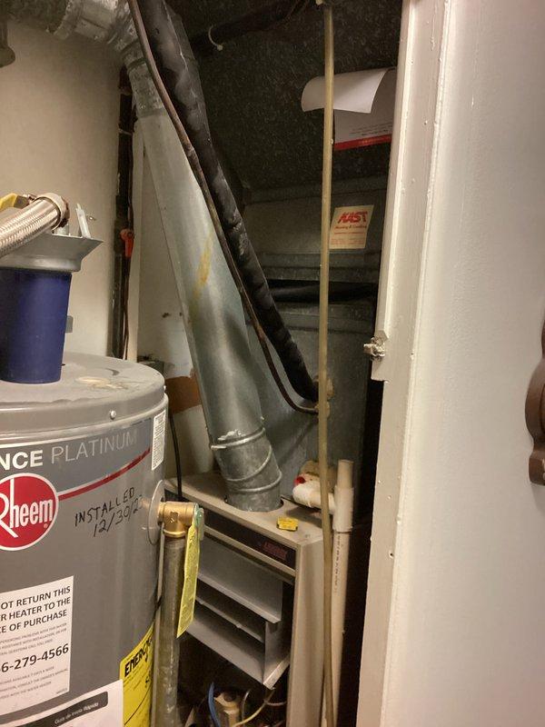 Technician responded to provide air conditioning replacement estimate. Upon inspection, discovered damaged wiring due to rodent activity. Conducted comprehensive system evaluation and identified low refrigerant levels, though unit maintained cooling capacity at time of assessment. Documented existing HVAC equipment and mechanical room conditions, including water heater, ductwork connections, and plumbing components for estimate preparation purposes.