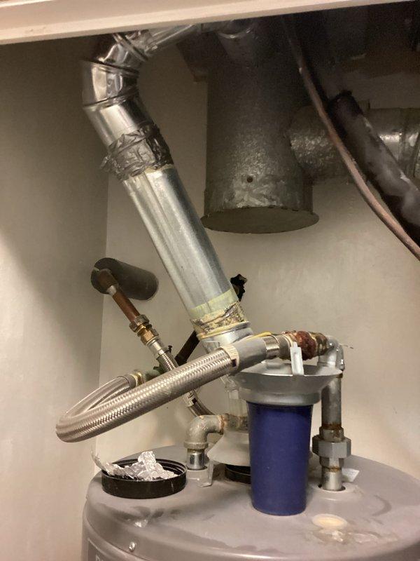 Technician responded to provide air conditioning replacement estimate. Upon inspection, discovered damaged wiring due to rodent activity. Conducted comprehensive system evaluation and identified low refrigerant levels, though unit maintained cooling capacity at time of assessment. Documented existing HVAC equipment and mechanical room conditions, including water heater, ductwork connections, and plumbing components for estimate preparation purposes.