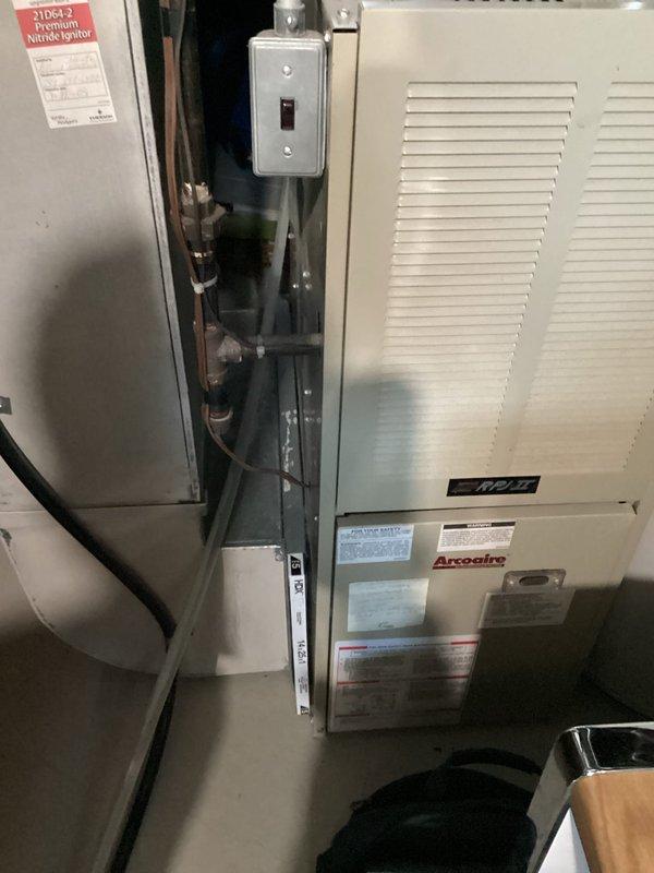 Provided comprehensive estimate for complete HVAC system replacement of 30-year-old equipment currently in operational condition. Evaluated existing basement installation including furnace, air handler, and associated ductwork system. Assessed mechanical room configuration with Arcoaire equipment, refrigerant lines, PVC condensate drainage, and electrical components to determine specifications for new system installation including natural gas furnace and compatible cooling unit.