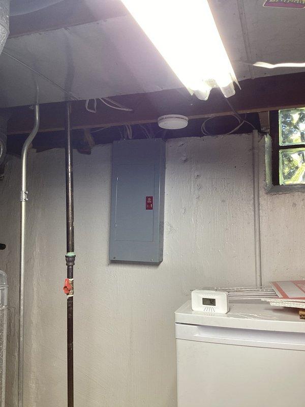 Conducted on-site assessment for central air conditioning installation at residence currently without AC. Evaluated existing HVAC infrastructure in basement utility area, including furnace/air handler unit, ductwork system, electrical panel capacity, and available space for equipment placement. Documented existing mechanical systems and provided comprehensive estimate for full AC system installation including outdoor condensing unit, refrigerant lines, thermostat controls, and necessary electrical connections to integrate with current heating system.