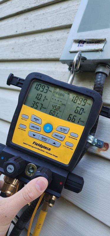 Completed comprehensive cooling system maintenance and tune-up on residential HVAC unit. System operational check confirmed proper function with all parameters within normal range. Performed standard maintenance protocol including inspection of condenser unit, fan assembly, and electrical components. Refrigerant pressures and temperatures measured using digital manifold gauge, verifying optimal system performance and charge levels. Inspected outdoor unit housing, fan blade assembly, and protective grille for proper operation and condition.
