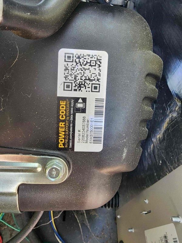 Completed scheduled generator maintenance inspection and service. Documented equipment identification including power code inlet connector harness with serial and part numbers for maintenance records. Replaced two worn capacitors from the generator's electrical system to ensure proper starting and running capabilities. Verified all electrical connections, inspected wiring harness integrity, and confirmed proper operation of motor components following capacitor replacement.